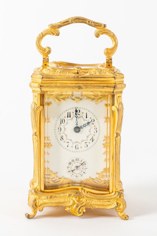 A FRENCH GILT BRASS STRIKING AND REPEATING ROCOCO STYLE CARRIAGE CLOCK