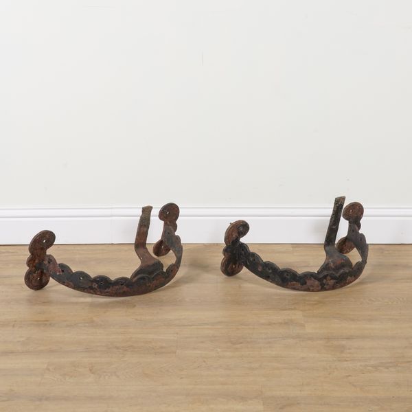 A PAIR OF VICTORIAN CAST IRON DEMI LUNE WALL MOUNTED BOOT SCRAPERS (2)