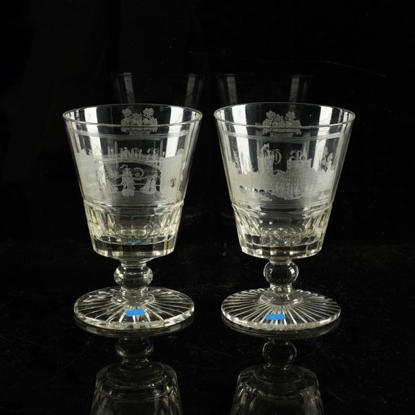 A PAIR OF ENGRAVED GLASS GOBLETS (2)