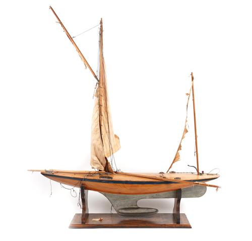 A WOODEN POND YACHT