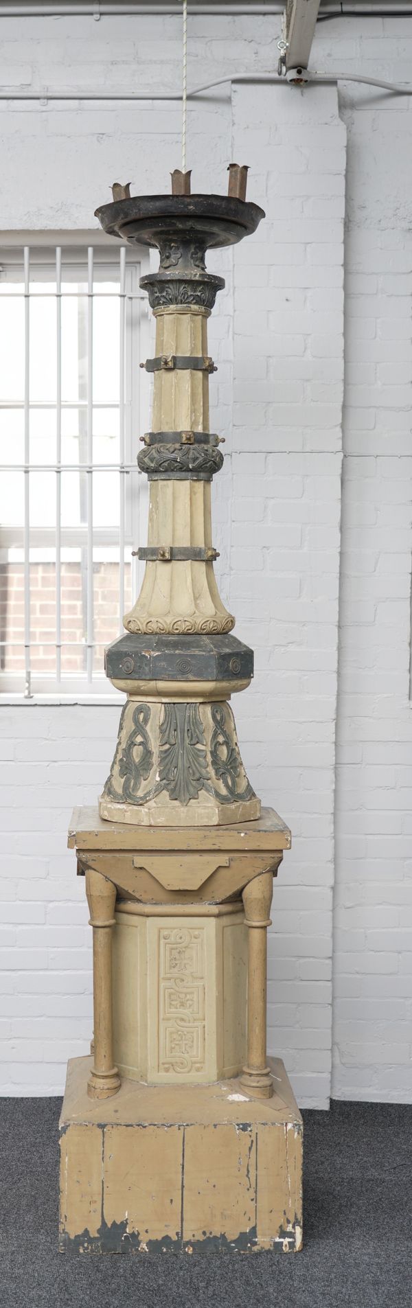 A LARGE GOTHIC REVIVAL GREY PAINTED FLOOR STANDING TORCHERE STAND