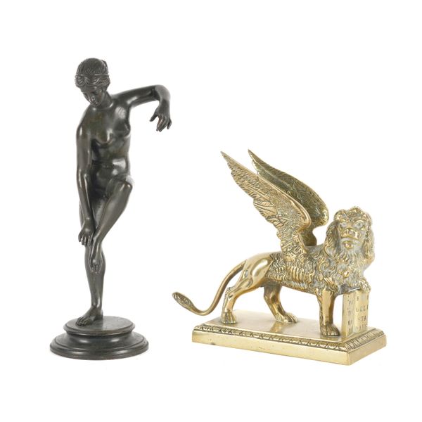 A PATINATED BRONZE FIGURE A FEMALE BATHER TOGETHER WITH A POLISHED BRASS MODEL OF THE LION OF SAINT MARK  (2)