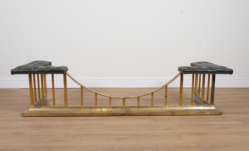 A BRASS AND GREEN LEATHER BUTTON-DOWN CLUB FENDER