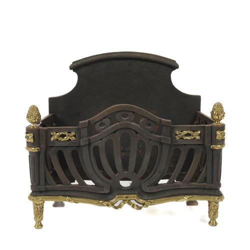 A GEORGE III STYLE GILT-BRASS MOUNTED CAST IRON FIRE BASKET OR GRATE