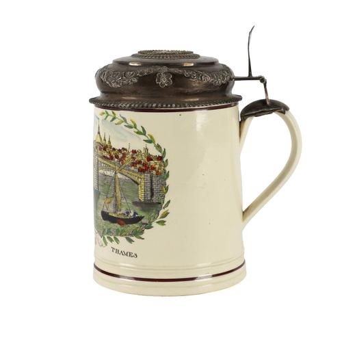 AN EARTHENWARE TANKARD SET WITH ASSOCIATED EUROPEAN SILVER MOUNTS