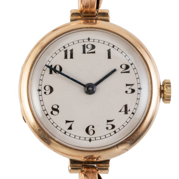 AN EDWARDIAN 9CT GOLD LADY'S WATCH