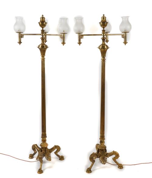 A PAIR OF REGENCY STYLE GILT METAL THREE LIGHT FLOOR STANDING CANDELABRA (2)