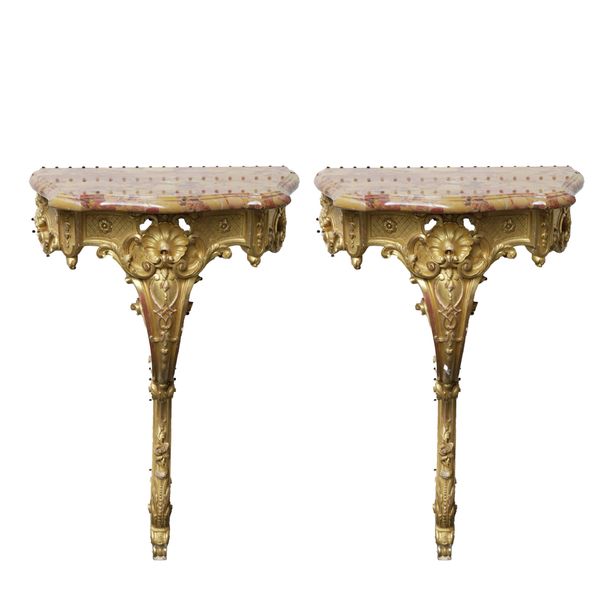 A PAIR OF 19TH CENTURY GILTWOOD SERPENTINE BRECHE D'ALEP MARBLE TOPPED CONSOLE TABLES (2)
