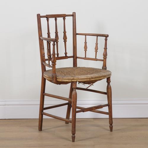 A REGENCY STAINED BEECH OPEN ARMCHAIR
