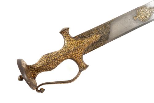 AN ISLAMIC TALWAR (TEGH/TEGHA) WITH KOFTGARI DECORATION