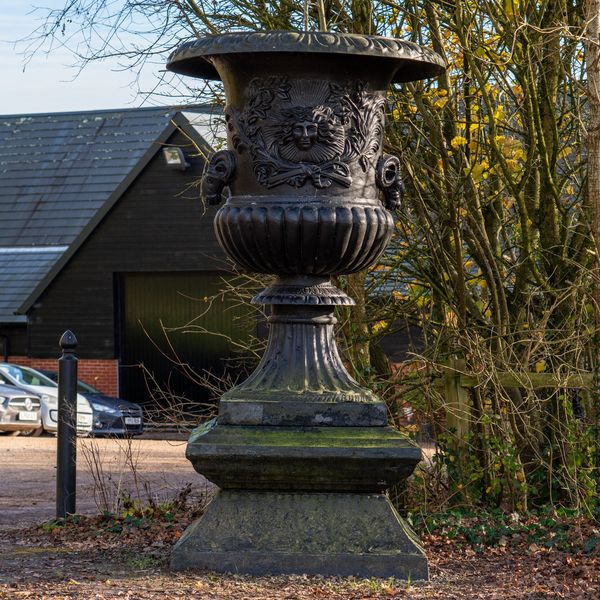 A MONUMENTAL BLACK PAINTED CAST IRON URN