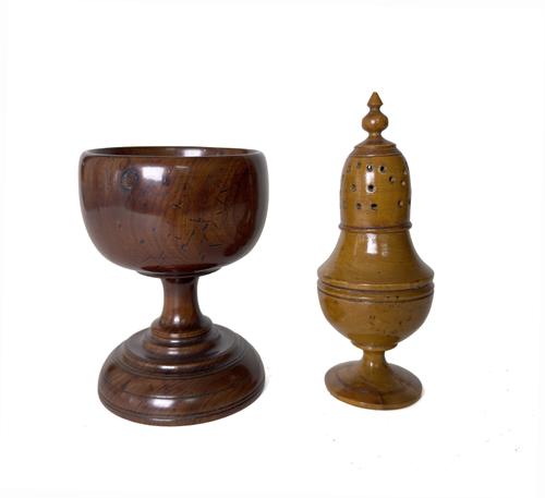 A TREEN YEW WOOD TABLE SALT AND A FRUITWOOD SUGAR MUFFINEER (2)