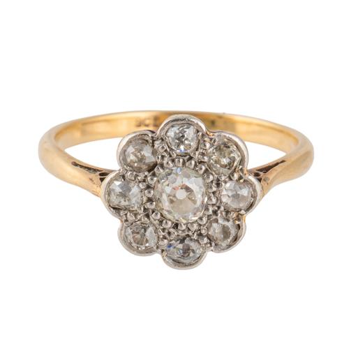 A GOLD AND PLATINUM, DIAMOND NINE STONE CLUSTER RING