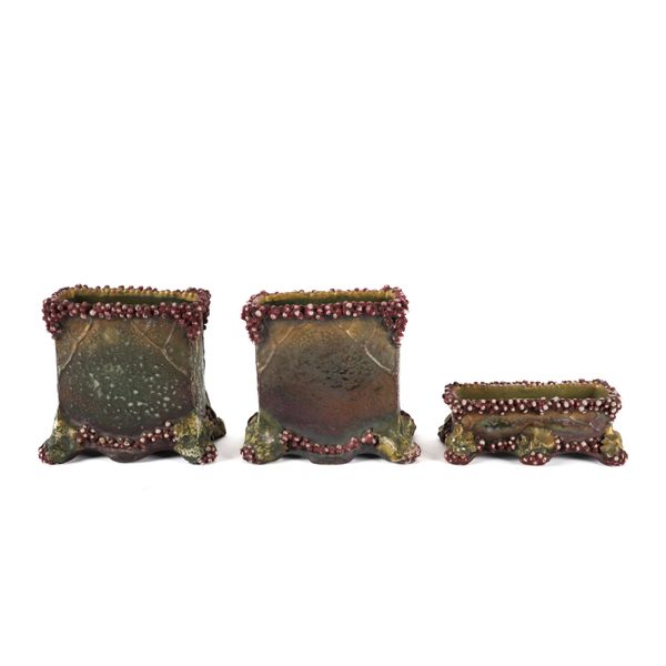 A PAIR OF AMPHORA WARE LUSTRE VASES AND A SMALLER EXAMPLE (3)