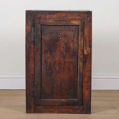 A 17TH CENTURY ELM SINGLE DOOR FOOD CUPBOARD