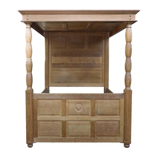 A HONEY OAK CARVED FOUR POSTER BED