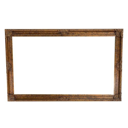 A LARGE GILT FRAMED WALL MIRROR