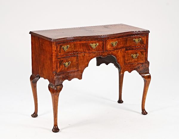 An 18th century style figured walnut serpentine lowboy, with four frieze drawers on cabriole supports, 94cm wide x 77cm high.