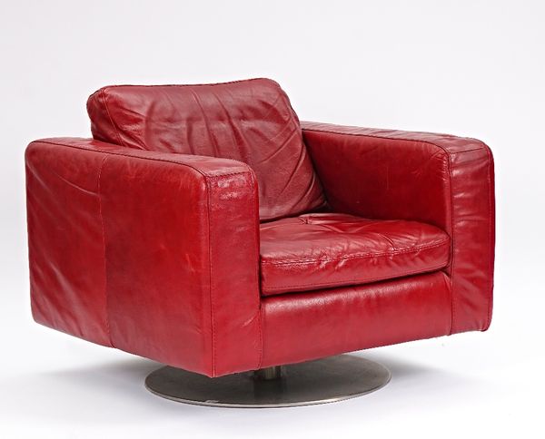 Natuzzi, a red leather upholstered square back easy armchair on chrome swivel base, 90cm wide x 60cm high.