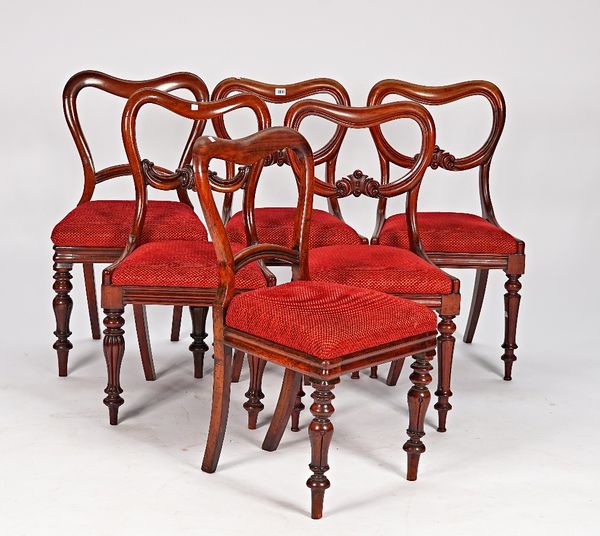 A matched set of six early Victorian mahogany kidney back dining chairs