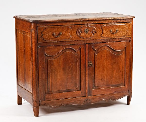 A 19th century French oak buffet with single drawer over a pair of arch panel cupboards, 125cm wide x 103cm high.