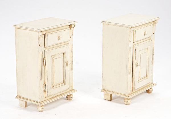 A pair of cream painted pine bedside tables, each with a single drawer over cupboard, 48cm wide x 70cm high (2).