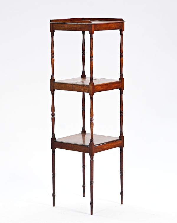 A 19th century mahogany three tier what-not on turned supports, 40cm wide x 139cm high.