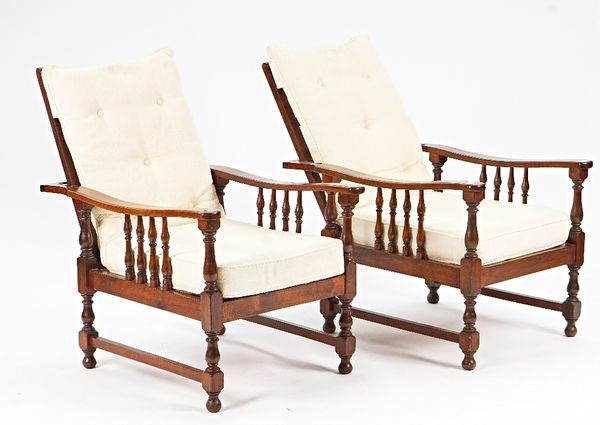 A pair of mid-20th century stained beech framed reclining open armchairs on block and turned supports, 63cm wide.