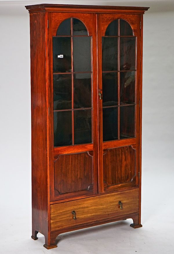 An early 20th century mahogany floor standing display cabinet