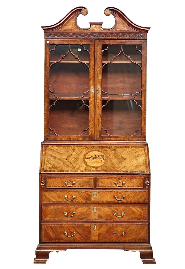 A George III inlaid mahogany bureau bookcase with swan neck cornice over astragal glaze door, fitted interior with two short and three long graduated...