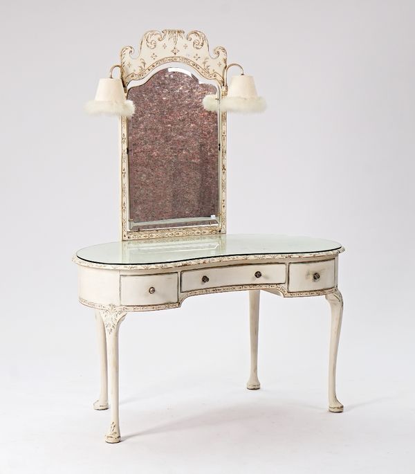 A mid-20th century white painted kidney shape dressing table with lamp mounted swing mirror over three drawers on pad feet, 120cm wide x 164cm high. ...