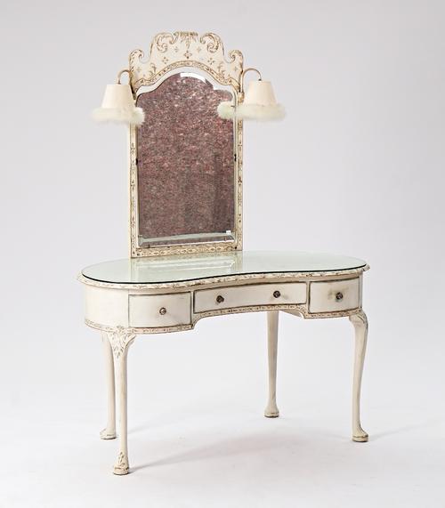 A mid-20th century white painted kidney shape dressing table with lamp mounted swing mirror over three drawers on pad feet, 120cm wide x 164cm high. ...