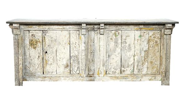 A large pine bar, the grey painted plank top over a distressed tongue and groove panelled front, the reverse with a single drawer and three recesses,...