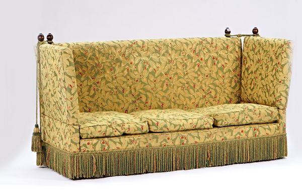 A Knole square back drop arm sofa with tassel frieze, 220cm wide x 113cm high.