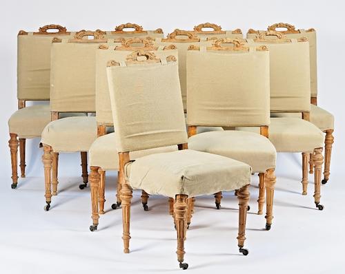 A set of ten Victorian dining chairs with loose hessian upholstery and bleached out frames on tapering fluted supports, 47cm wide x 98cm high (10).