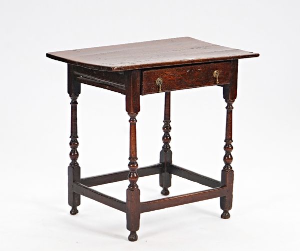 A 17th century oak single drawer side table, on turned supports, united by perimeter stretcher, 74cm wide x 71cm high.