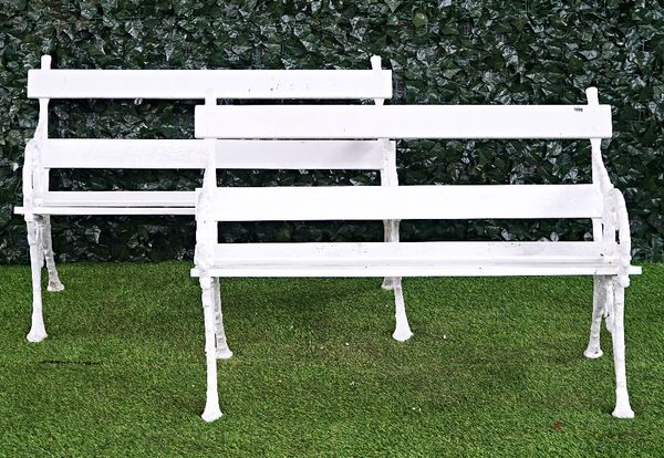 A pair of early 20th century white painted cast iron garden benches (2).