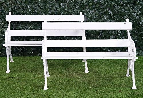 A pair of early 20th century white painted cast iron garden benches (2).