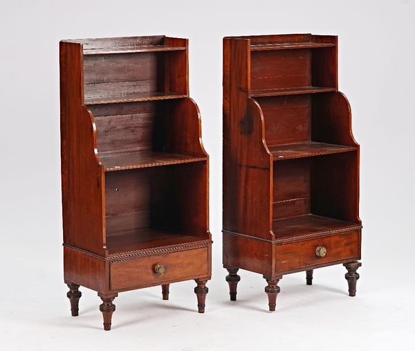 A pair of Regency style brass inlaid mahogany four tier waterfall bookcases with single drawer base on turned supports, 55cm wide x 120cm high (2).