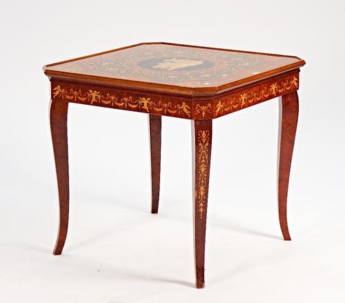 An Italian marquetry inlaid figural walnut games table.