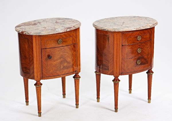 A pair of Louis XVI style oval marble top bedside tables (2).