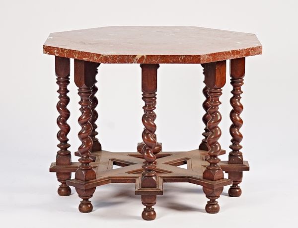 An oak centre table, the marble top, 4cm thick, on eight barley-twist supports united by stretchers, 99cm wide x 76cm high.
