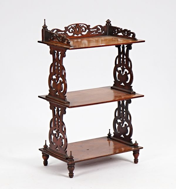 A Victorian mahogany three tier what-not with pierced fret supports, 60cm wide x 100cm high.