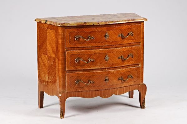 A French gilt metal mounted kingwood serpentine commode