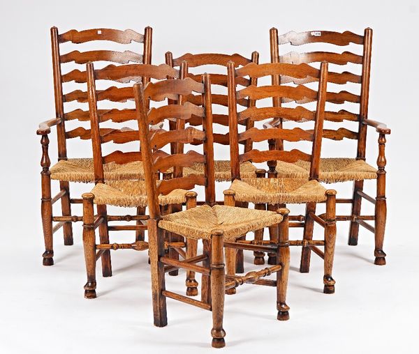 A set of six rush seated ash ladder back dining chairs (6).