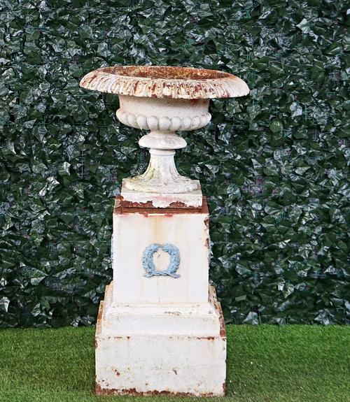 A Victorian white painted cast iron garden urn