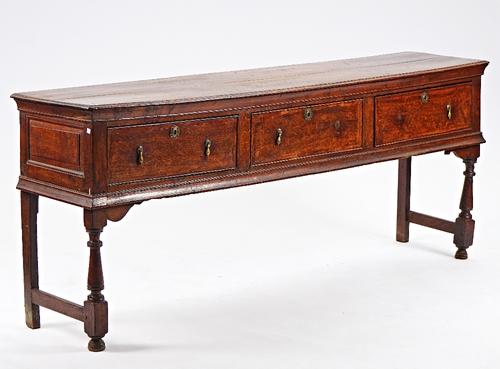 A mid-18th century oak dresser base.