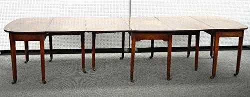 A George III mahogany D-end extending dining table