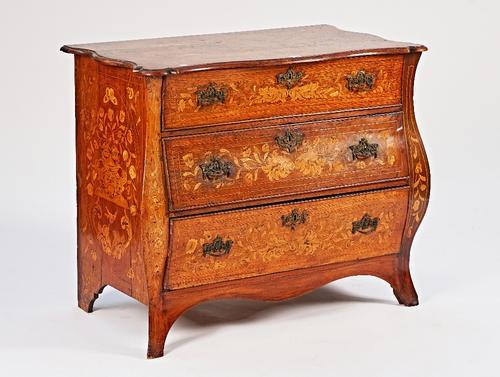 A Dutch early 19th century marquetry inlaid bombe serpentine chest
