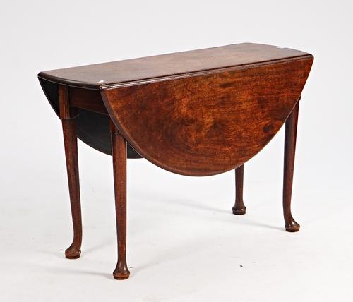A George II mahogany oval drop flap table on pad feet, 106cm long x 112cm wide open.